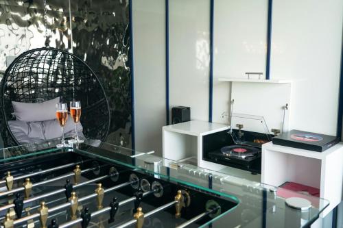 a room with a counter with a bird cage on it at The Wade in Chicago