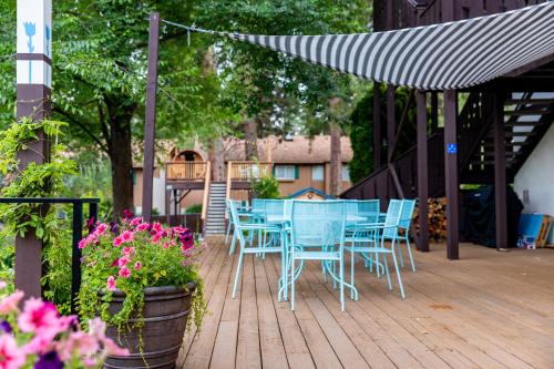 a blue table and chairs on a wooden deck at Blue Elk Inn in Leavenworth