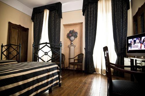 Postel nebo postele na pokoji v ubytování Hotel Regina