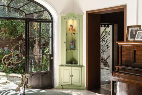 a room with a door with two vases on it at Villa Ganz Boutique Hotel in Guadalajara