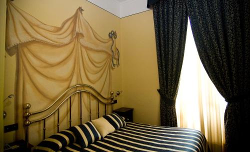 Katil atau katil-katil dalam bilik di Hotel Regina