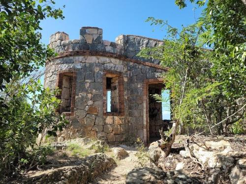 an old stone building sitting on top of a hill at Boricua 3 Studio Apt C Air Conditioning Wi Fi in Yauco
