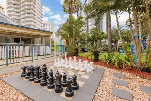 a chessboard on a sidewalk in a park at Club Wyndham Kirra Beach in Gold Coast