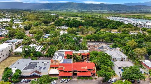 an aerial view of a town with a red roof at Villa San Michele (Official) in Port Douglas
