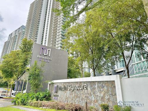 a sign in front of a building at Medini Signature Near Legoland By Stayrene in Iskandar Puteri