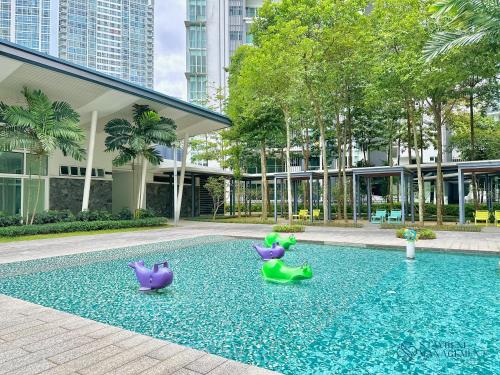 three rubber ducks in a pool in a building at Medini Signature Near Legoland By Stayrene in Iskandar Puteri