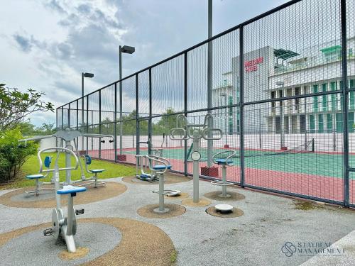 a group of playground equipment on a tennis court at Medini Signature Near Legoland By Stayrene in Iskandar Puteri