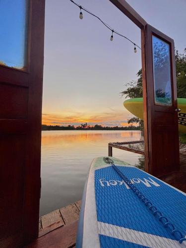 a view from the door of a boat on a lake at The Lake Farm - Dak Lak in Buon Ma Thuot