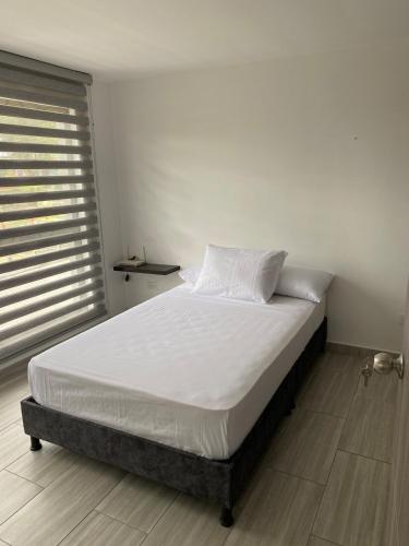 Postel nebo postele na pokoji v ubytování Apartamento en ulloa