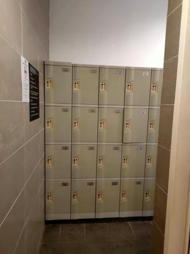 a row of metal lockers in a room at EcoNest 3Bedroom Family Apartment 8px Near Legoland in Iskandar Puteri