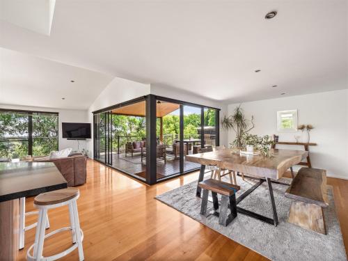 a living room with a table and a dining room at The Office Escape - Gnarabup Margaret River in Gnarabup