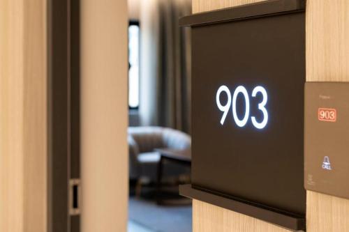 a clock on a wall in a hotel room at Hound Hotel Yeonsan in Busan