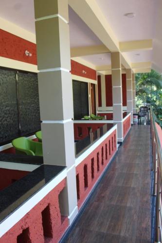 a hallway of a hotel with a cafeteria at hope villa homestay gokarna in Gokarna