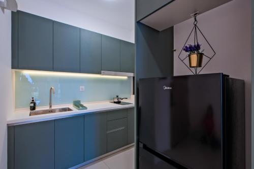 Kuchyň nebo kuchyňský kout v ubytování G Residence Sky Suite