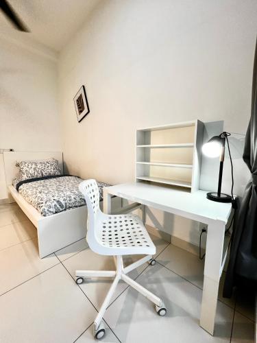a bedroom with a desk and a bed at EcoNest 3Bedroom Family Apartment 8px Near Legoland in Iskandar Puteri