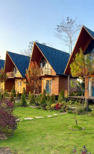 a house with a large yard in front of it at The Lake Farm - Dak Lak in Buon Ma Thuot