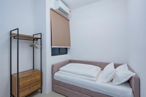 Postel nebo postele na pokoji v ubytování G Residence Sky Suite