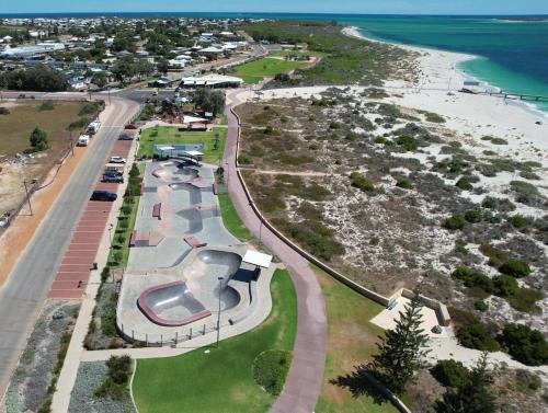 an aerial view of a park next to the beach at Sandpiper Escape in Jurien Bay
