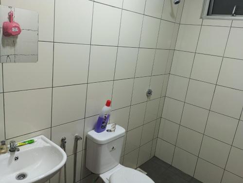 a bathroom with a toilet and a sink at mazya homestay in Melaka