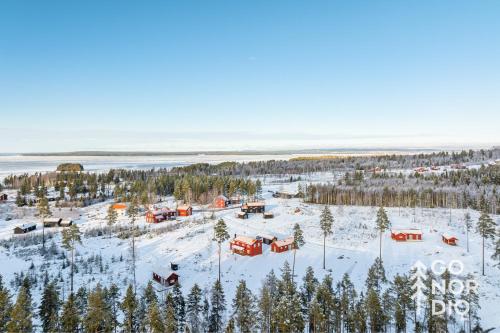 an aerial view of a resort in the snow at Red Fox Cabin in Tällberg