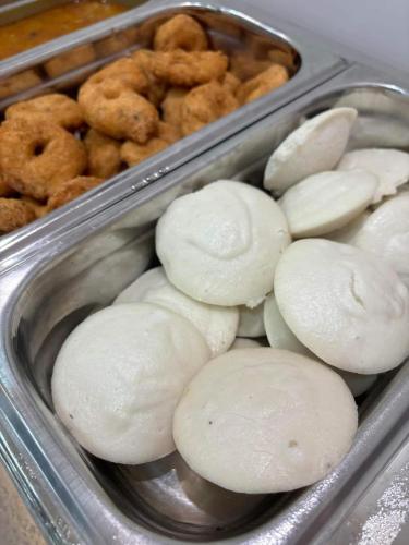 two trays of onion rings and other food items at Swet Palash Resort in Purulia