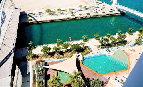 an aerial view of the pool at the resort at Studio In Al Hadeel Hosted By Voyage in Abu Dhabi