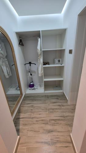 a dressing room with a mirror and a hallway at مزرعة-جوري--Jory-Farmhouse in Hatta