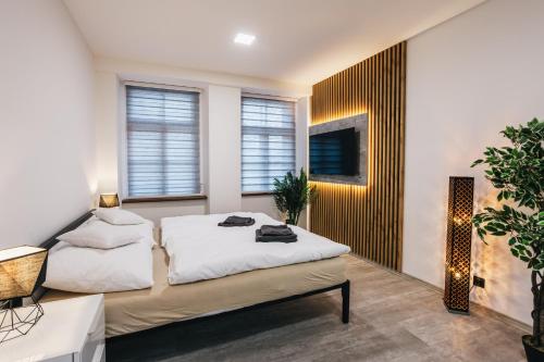 Postel nebo postele na pokoji v ubytování Apartmány U Doskočilů