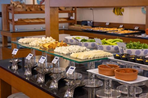 a buffet with different types of food on display at Anemon Grand Eskişehir Otel in Eskisehir
