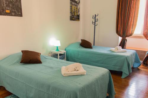 Katil atau katil-katil dalam bilik di Guest House Guerra Junqueiro II