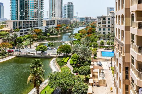 a view of a river in a city with buildings at The Views & Greens - Mosela Tower, Dubai in Dubai