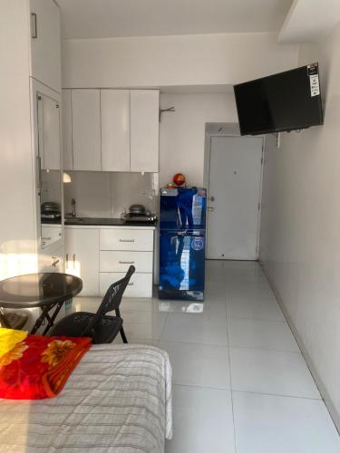 Η κουζίνα ή μικρή κουζίνα στο Maati Properties, Room 313