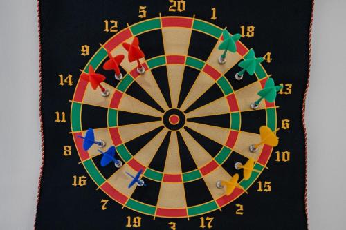 a dartboard with people playing darts on it at Secluded 9BR Getaway, Pool, Hot Tub & Huge Deck in Chester