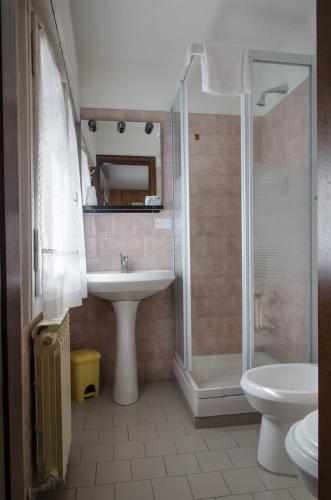 a bathroom with a sink and a shower at Hotel Capriolo in Vidiciatico