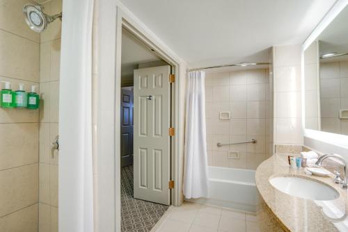 a bathroom with a sink and a shower at Crowne Plaza New Orleans French Qtr - Astor by IHG in New Orleans
