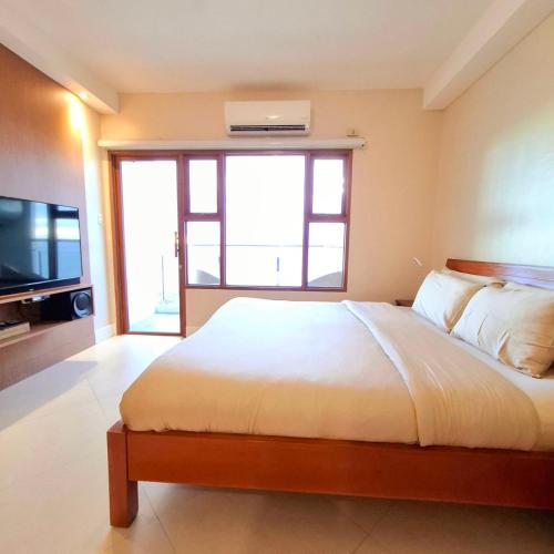 Cama o camas de una habitación en MANILA BAYVIEW RENTAL- LUXURY AND SUPERIOR 1 - 5 BEDROOM CONDOS WITH BALCONY POOL BAYVIEWS NETFLIX - Housekeeping Available-