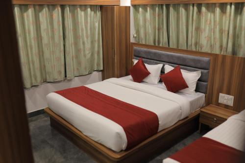 Postel nebo postele na pokoji v ubytování Hotel Maruti R