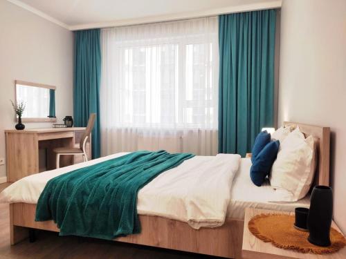 Ένα ή περισσότερα κρεβάτια σε δωμάτιο στο Qonaq Apartments 4YOU 191