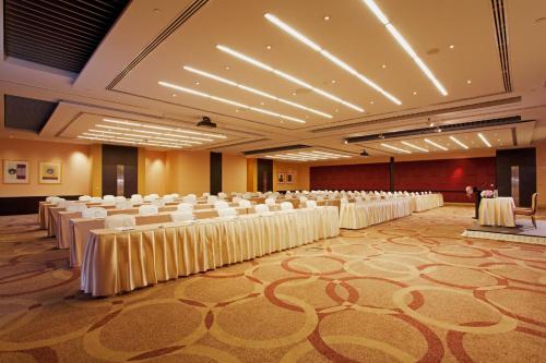 a large banquet hall with white tables and chairs at Centara Grand At CentralWorld in Bangkok