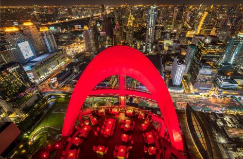 an aerial view of a city at night at Centara Grand At CentralWorld in Bangkok