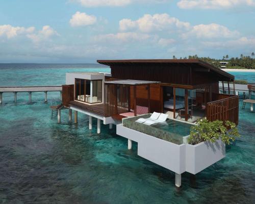 a rendering of a house on the water at Park Hyatt Maldives Hadahaa in Gaafu Alifu Atoll