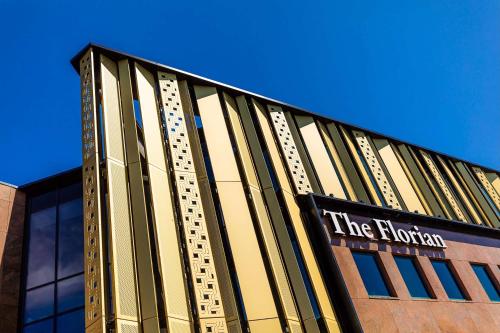 a building with a sign on the front of it at The Florian Amsterdam Schiphol Airport, WorldHotels Crafted in Hoofddorp