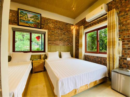 Postel nebo postele na pokoji v ubytování Green Space Homestay