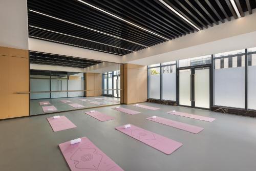 a yoga room with pink mats on the floor at Citadines Science City Guangzhou-Shuttle bus to Canton Fair Complex during Canton Fair period in Guangzhou
