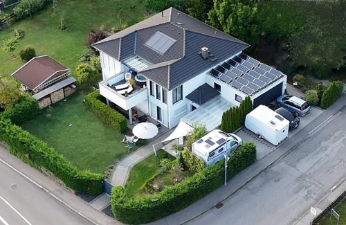 an aerial view of a house with a solar roof at Auszeit im Heinental in Wildberg
