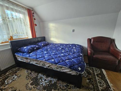 En eller flere senge i et værelse på Casa Larisa