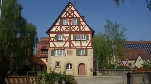 a tall building with a tower on top of it at Ferienhof Ott im Rothenburger Land in Adelshofen