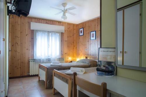 a living room with a couch and a table at Hotel Capriolo in Vidiciatico