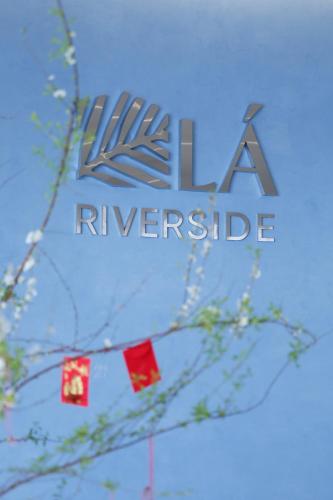 a logo for theeneurance company is pictured at Lá Riverside Boutique Hotel in Mỹ Phước