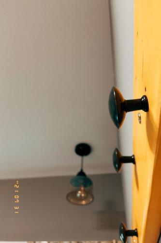 a door with a door knob and a stool at Little Ryukyu Hermit Crab Homestay in Xiaoliuqiu